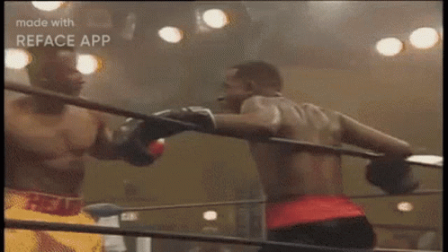 Two Boxers Fighting One Wearing Red Belt