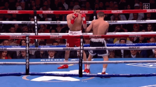Two Boxers in Ring With Golden Boy Sign