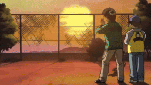 Two Boys Are Standing In Front Of A Fence And Watching The Sun Set GIF