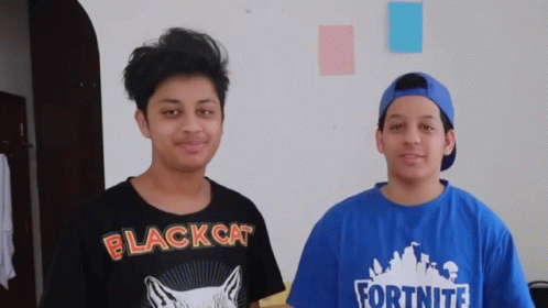 Two Boys One In Black Cat Shirt And One In Fortnite Shirt GIF