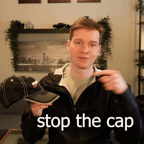 Two Boys Sitting at Desk with Cap Check