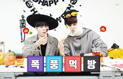 Two Boys Sitting at Halloween Party