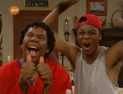 Two Boys Thumbs Up One With Red Hat