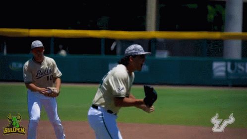 Two Bullpen Baseball Players On The Field With A Bullpen Logo In The Background GIF