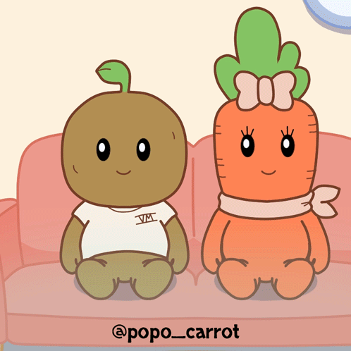 Two Carrots Sitting on Couch