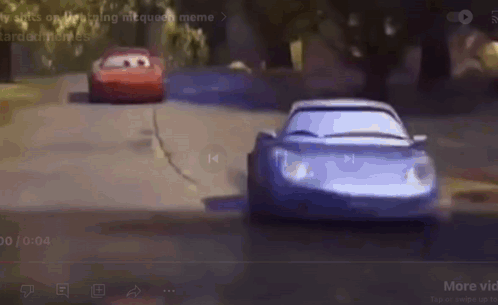 Two Cars Are Racing Down A Road In A Cartoon . GIF