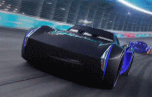 Two Cars Are Racing On A Race Track And One Has The Word Jackson Storm On The Front GIF