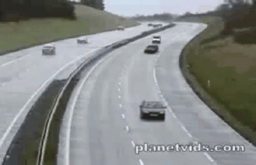 Two Cars Driving on Highway