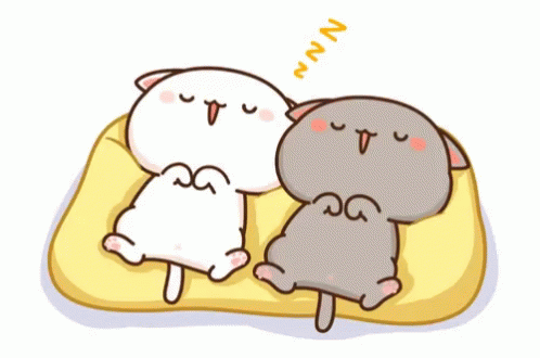 Two Cartoon Cats Are Sleeping On A Yellow Blanket And One Of Them Is Yawning GIF