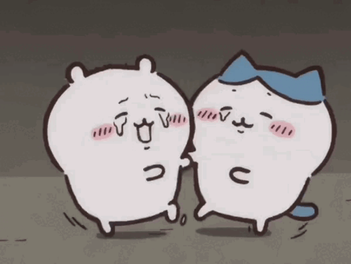Two Cartoon Cats One With Blue Hat
