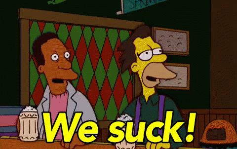 Two Cartoon Characters Are Sitting At A Bar And One Of Them Says We Suck ! GIF