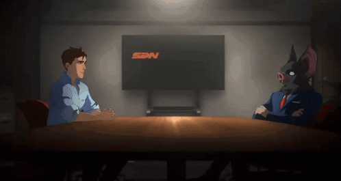 Two Cartoon Characters Are Sitting At A Table In Front Of A Screen That Says Sdn GIF