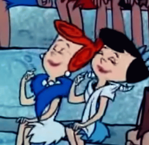 Two Cartoon Characters Are Sitting Next To Each Other On A Couch . GIF