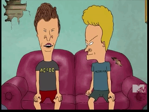 Two Cartoon Characters Are Sitting On A Couch One Is Wearing A Ac Dc Shirt And The Other Is Wearing A Metallica Shirt GIF