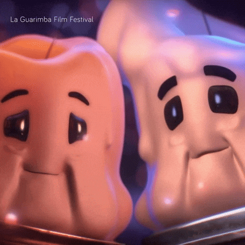 Two Cartoon Characters Are Standing Next To Each Other And The Words La Guarimba Film Festival Are On The Bottom Right GIF