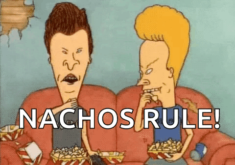 Two Cartoon Characters , Beavis And Butthead , Are Sitting On A Couch And Eating Nachos . GIF