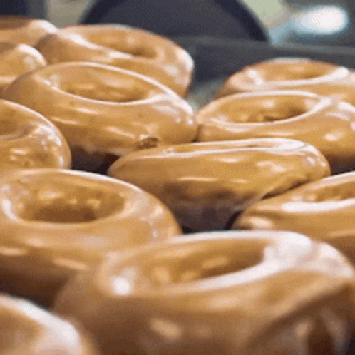 Two Cartoon Characters Eating Donuts from Regular Show