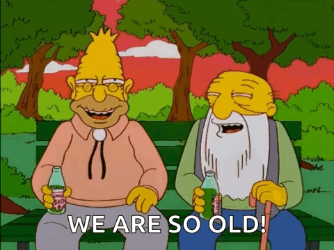 Two Cartoon Characters On Bench Holding Soda Saying We Are So Old GIF