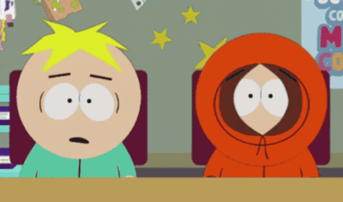 Two Cartoon Characters Sitting Beside ABC Sign