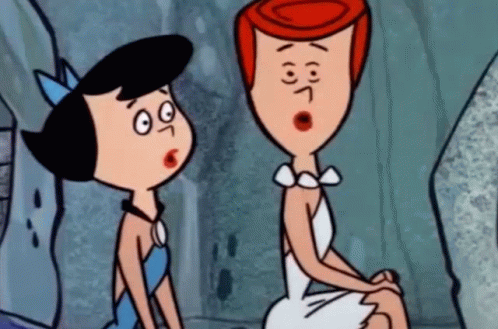 Two Cartoon Characters Sitting One Surprised