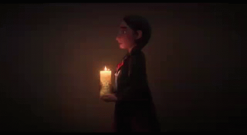 Two Cartoon Characters Standing Next To Each Other With One Holding A Candle In Front Of A Wall That Says Uno GIF