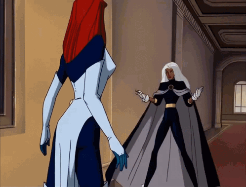 Two Cartoon Characters Standing Next To Each Other With One Wearing A Long Cape GIF