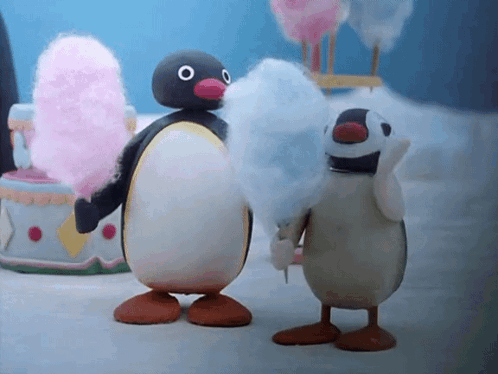 Two Cartoon Penguins Eating Cotton Candy