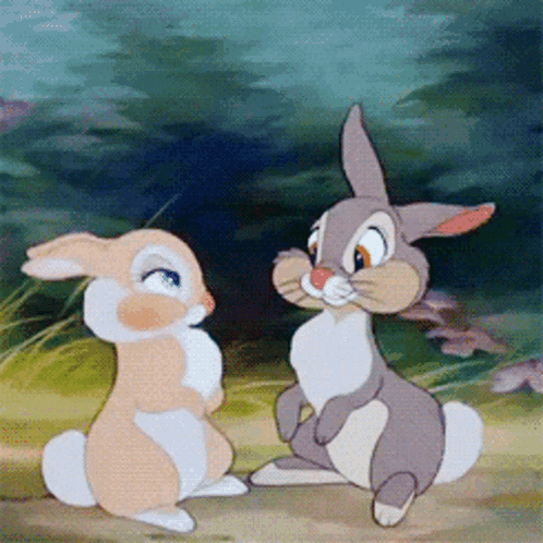Two Cartoon Rabbits Sitting GIF