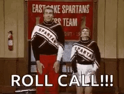 Two Cheerleaders Are Standing Next To Each Other In Front Of A Sign That Says `` Roll Call !!! '' . GIF