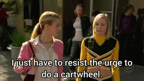 Two Cheerleaders One In Yellow And Black Outfit With Letter N GIF