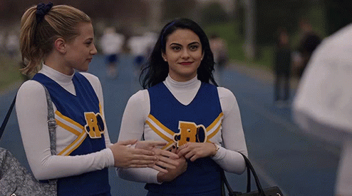 Two Cheerleaders With Letter R On Jersey GIF