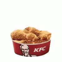 Two Chicken Wings Are In A Kfc Bowl . GIF