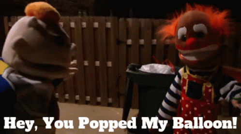 Two Clown Puppets Are Standing Next To Each Other With The Words Hey You Popped My Balloon Below Them GIF