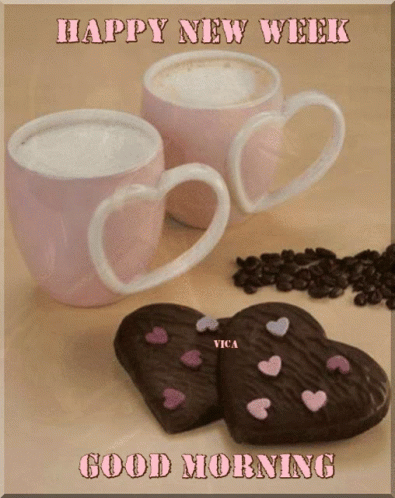 Two Coffee Cups With Heart Handles Next To Heart Cookies GIF