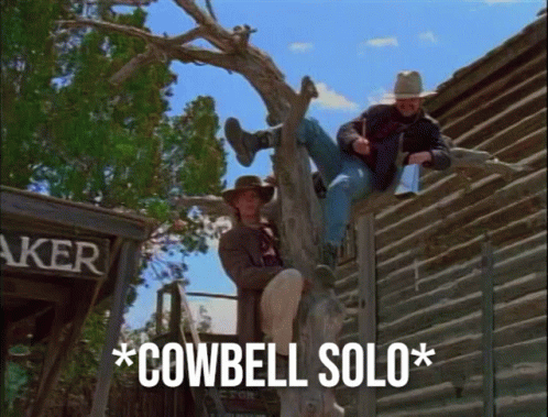 Two Cowboys Sitting on Tree With Cowbell Solo