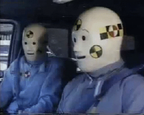 Two Crash Test Dummies Sitting In A Car GIF