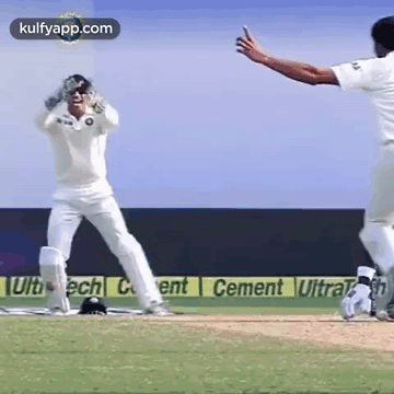 Two Cricket Players Playing on Cement Sponsored Field