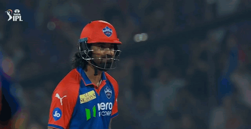 Two Cricket Players Standing Next To Each Other