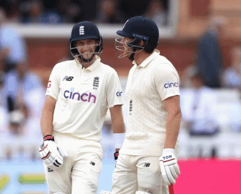 Two Cricket Players Wearing Cinch Jerseys Are Talking GIF