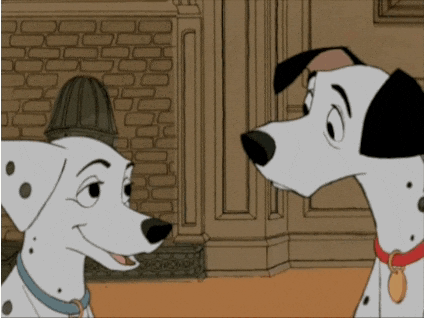Two Dalmatian Dogs Looking At Each Other In A Cartoon GIF