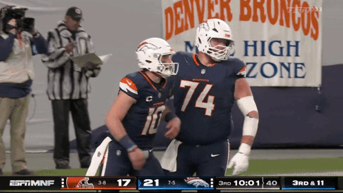 Two Denver Broncos Football Players On Field GIF
