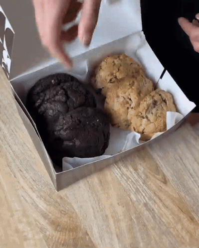 Two Different Types Cookies In Box On Wooden Table GIF