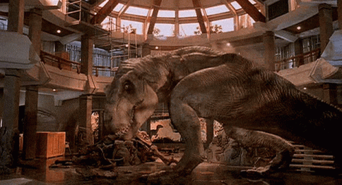 Two Dinosaurs Standing In Room GIF