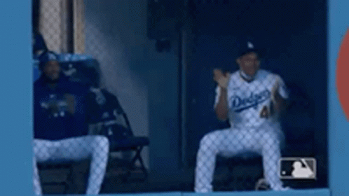 Two Dodgers Baseball Players Sitting