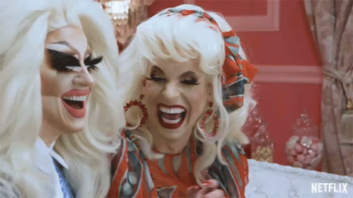 Two Drag Queens Laughing Face to Face