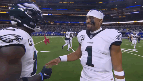 Two Eagles Football Players Shaking Hands