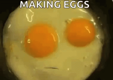 Two Eggs Cooking in Frying Pan Making Eggs