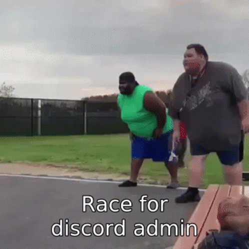 Two Fat Men Standing Together on Roadside