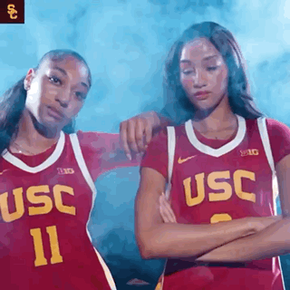Two Female Basketball Players in USC Red Jerseys