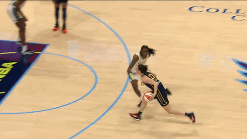 Two Female Basketball Players On A Court With A Wnba Logo In The Background GIF